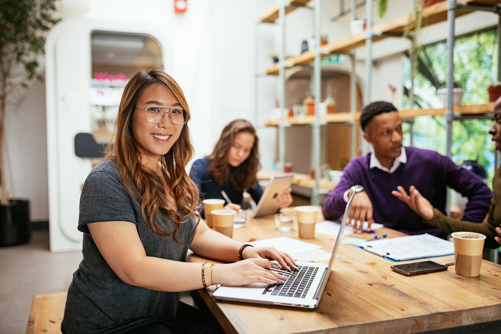 Employee portrait in coworking space - Chinese freelancer in coworking space